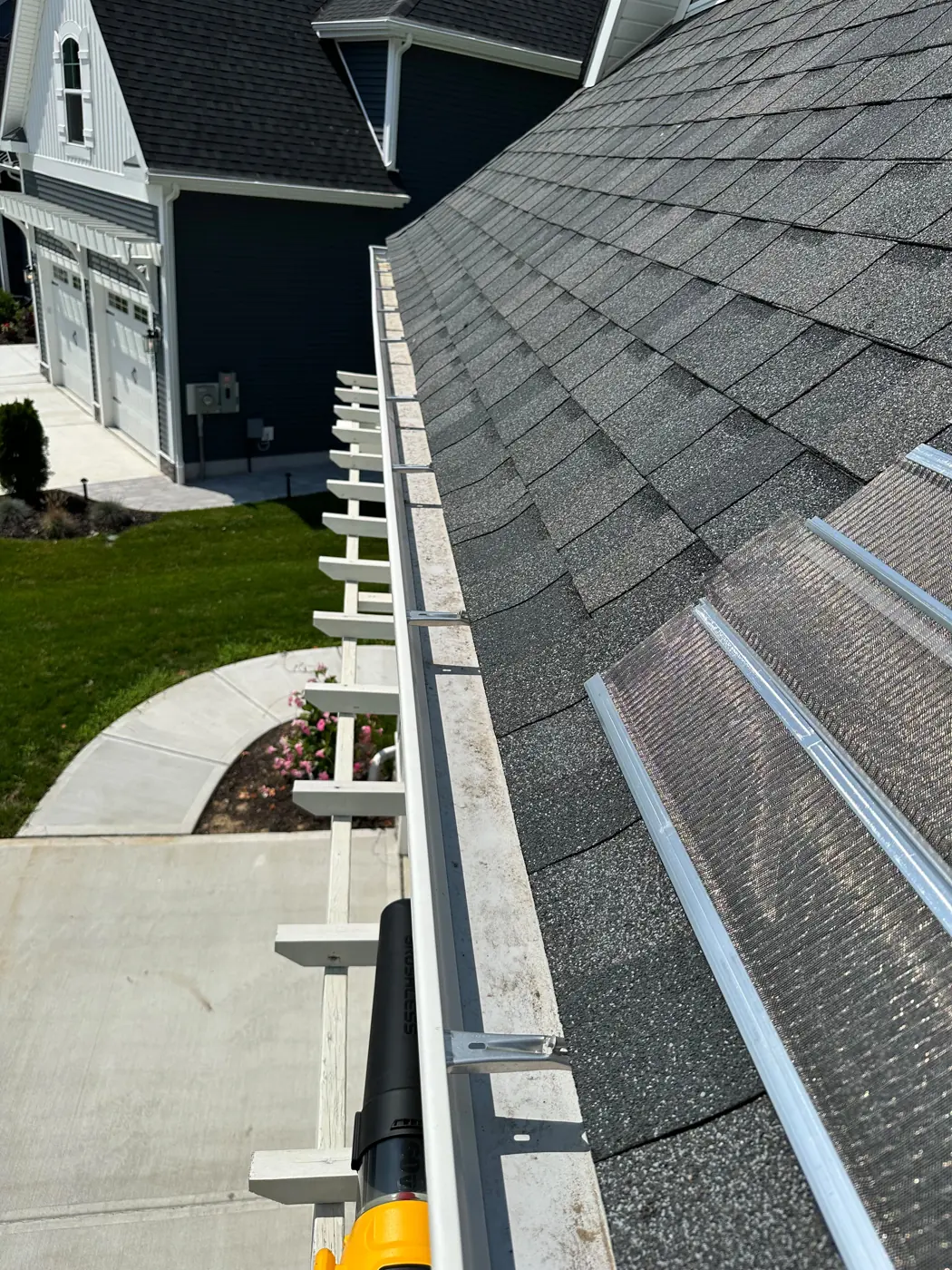 Gutter guard installation in progress