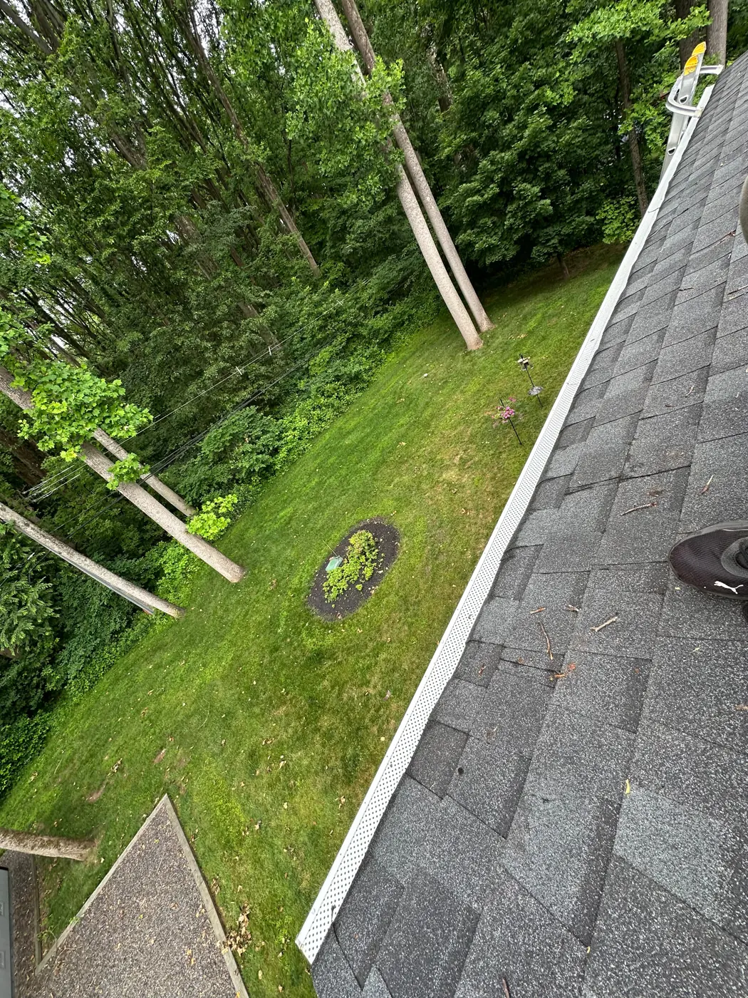 Long run of gutter guards along a roof edge