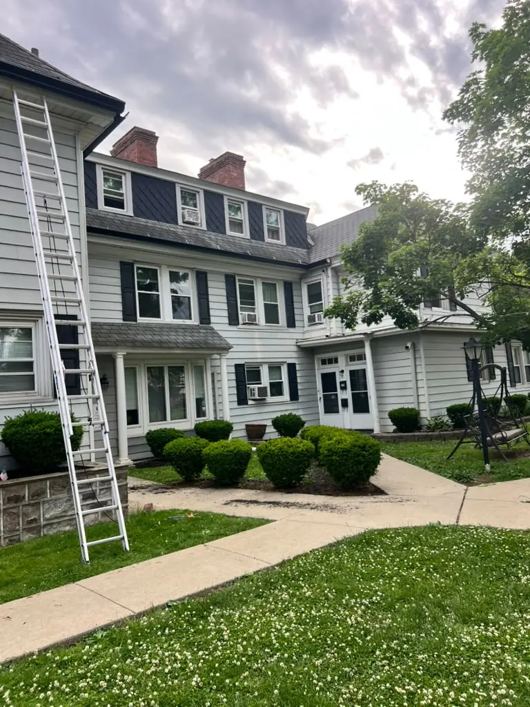 Gutter replacement on a large colonial
