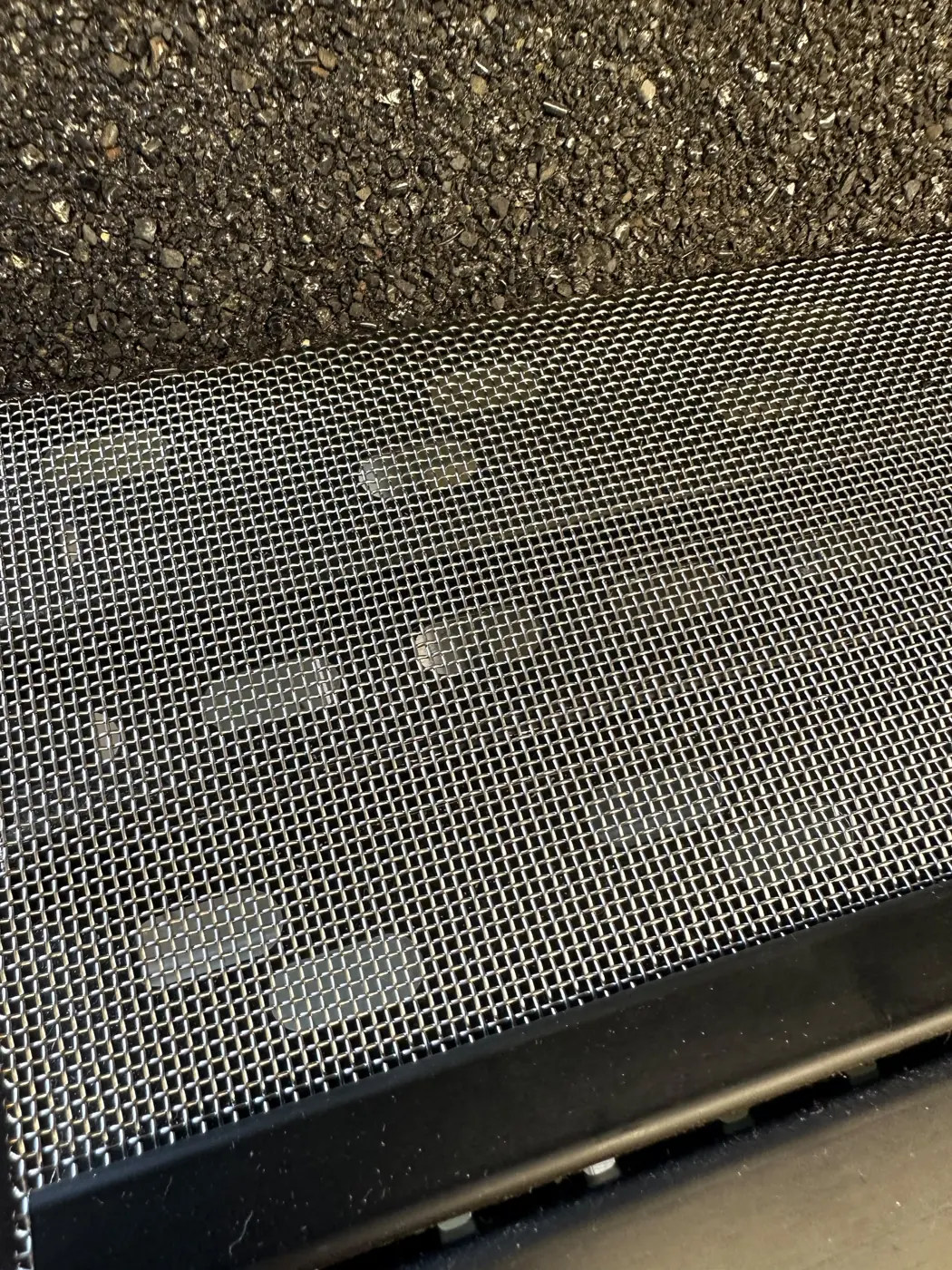 Close-up of stainless micro-mesh gutter guard