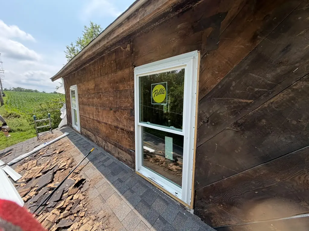 Old wood siding before replacement
