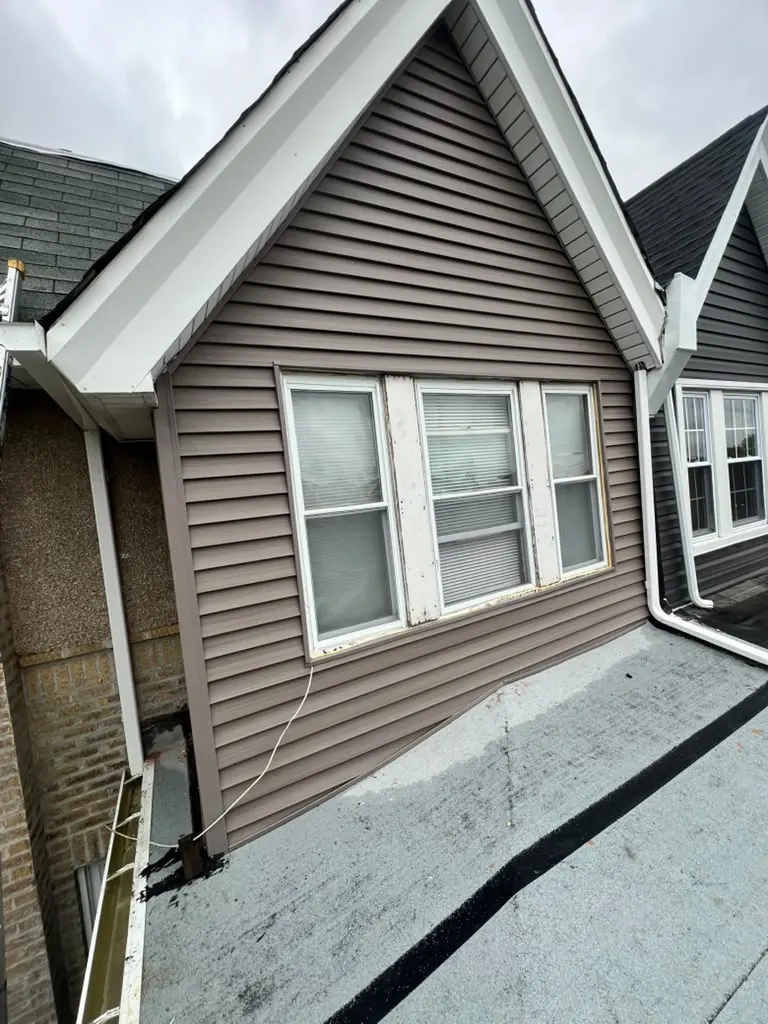 New siding on the rear of a rowhome
