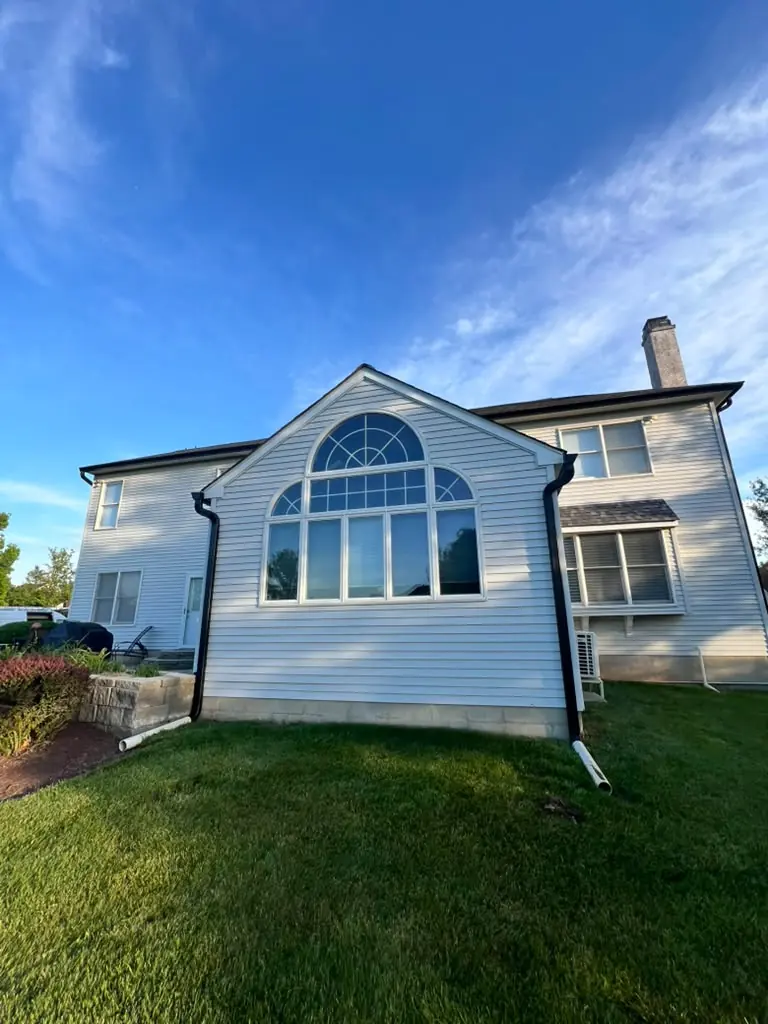 White home with new seamless aluminum gutters